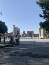 View of city buildings against clear sky