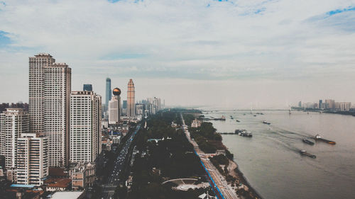 Panoramic view of buildings and city against sky