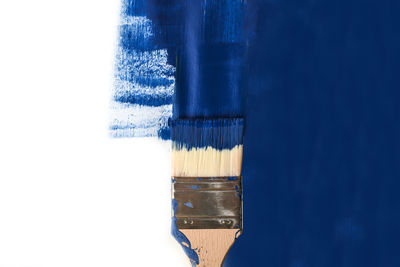 Close-up of paintbrush against white background