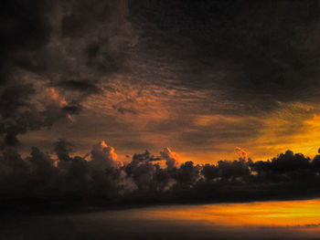 Low angle view of dramatic sky during sunset