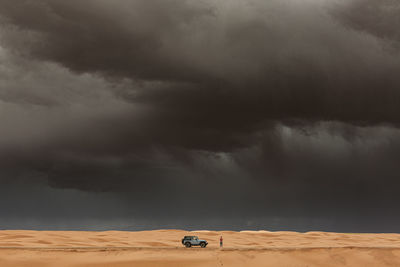 Woman gets out of jeep to take pictures of microburst in utah desert