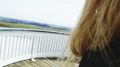 Close-up of woman against sky