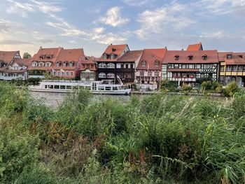 Buildings in city against sky