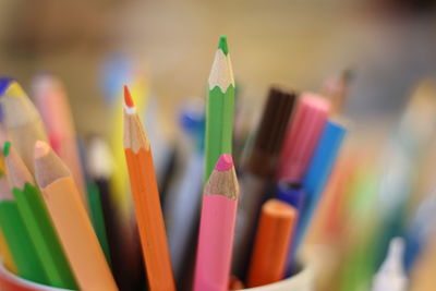Close-up of colored pencils in container