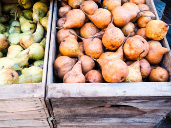 High angle view of fruits in crate at market stall