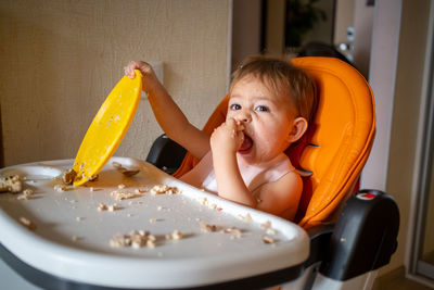 Portrait of cute girl eating food