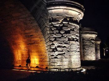 Low angle view of old building against sky at night