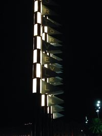 Low angle view of illuminated lights at night