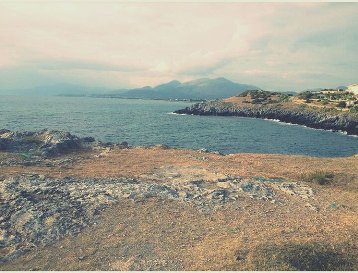 sea, scenics, beach, beauty in nature, sky, tranquil scene, no people, cloud - sky, mountain, outdoors, tranquility, nature, landscape, day