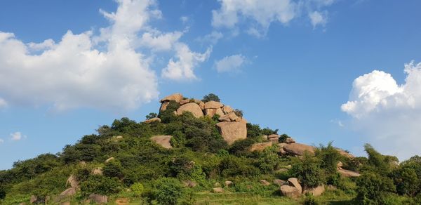 Low angle view of rocks against sky