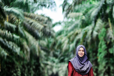 Portrait of young woman in forest