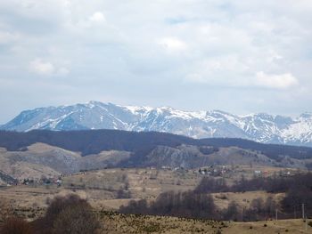 Scenic view of snowcapped mountains against sky