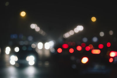 Defocused image of illuminated lights at night