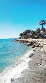 Scenic view of sea against clear blue sky