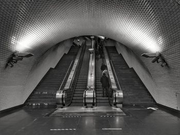 Low angle view of people walking in subway