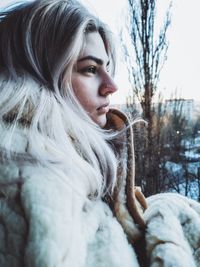 Close-up of thoughtful woman wearing warm clothing