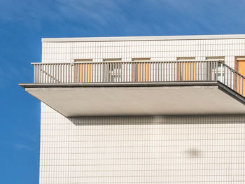 Low angle view of balcony on building against sky