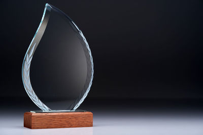 Close up of crystal trophy against gray background