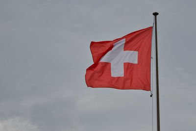 Low angle view of flag against sky