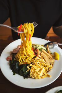 Midsection of man having food