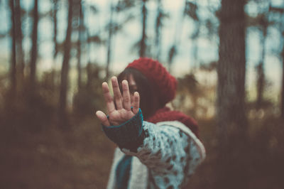 Close-up of a hand on tree