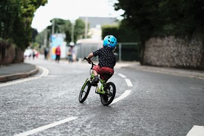 Man riding bicycle on road