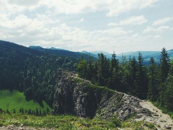 Scenic view of landscape against cloudy sky