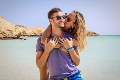 Young couple kissing on beach