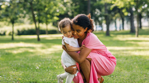 Mother and daughter on field