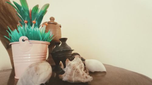 Close-up of stuffed toy in pot on table at home