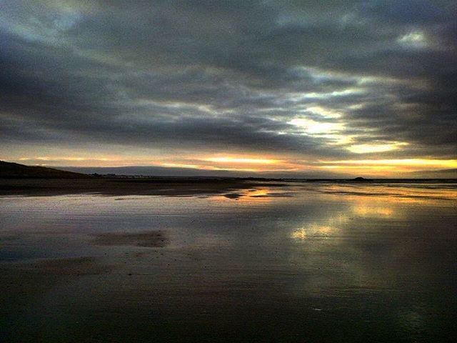 SCENIC VIEW OF SEA AGAINST DRAMATIC SKY