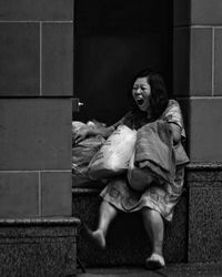 Portrait of smiling girl sitting outdoors