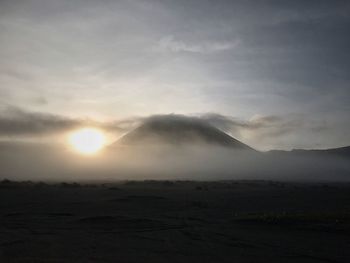 Scenic view of landscape against sky during sunset