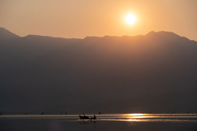 Scenic view of mountains against sky during sunset