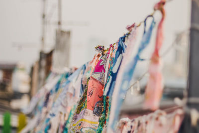 Close-up of clothes hanging on rack at market