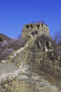 Low angle view of historical building against blue sky