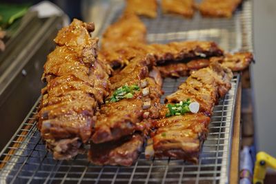 High angle view of meat on barbecue grill