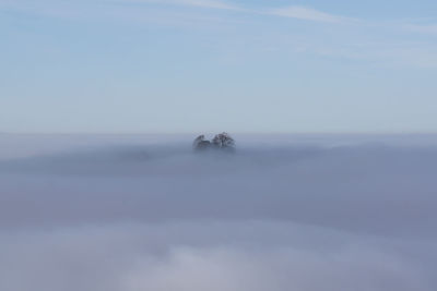 Scenic view sea of fog against sky