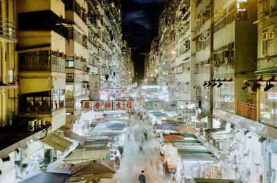 High angle view of buildings in city at night