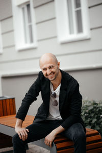 Portrait of a handsome smiling hipster man. a man dressed in a white