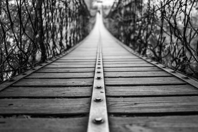 Surface level of wooden footbridge in forest