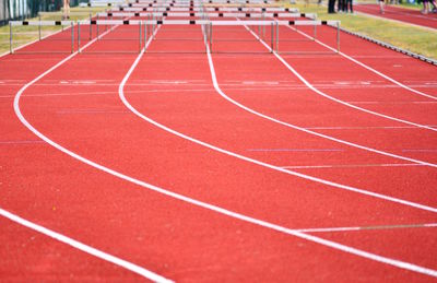 High angle view of hurdles on running track