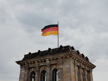 Low angle view of flag against sky