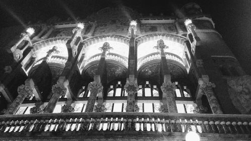 Low angle view of illuminated historic building against sky at night