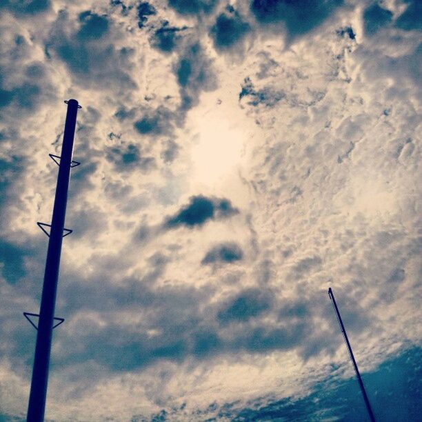 low angle view, sky, cloud - sky, street light, cloudy, cloud, blue, pole, nature, lighting equipment, beauty in nature, tranquility, cloudscape, weather, scenics, day, no people, outdoors, technology, overcast