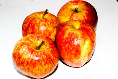 High angle view of apples on white background