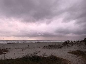 Scenic view of sea against storm clouds