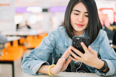 Mid adult man using mobile phone