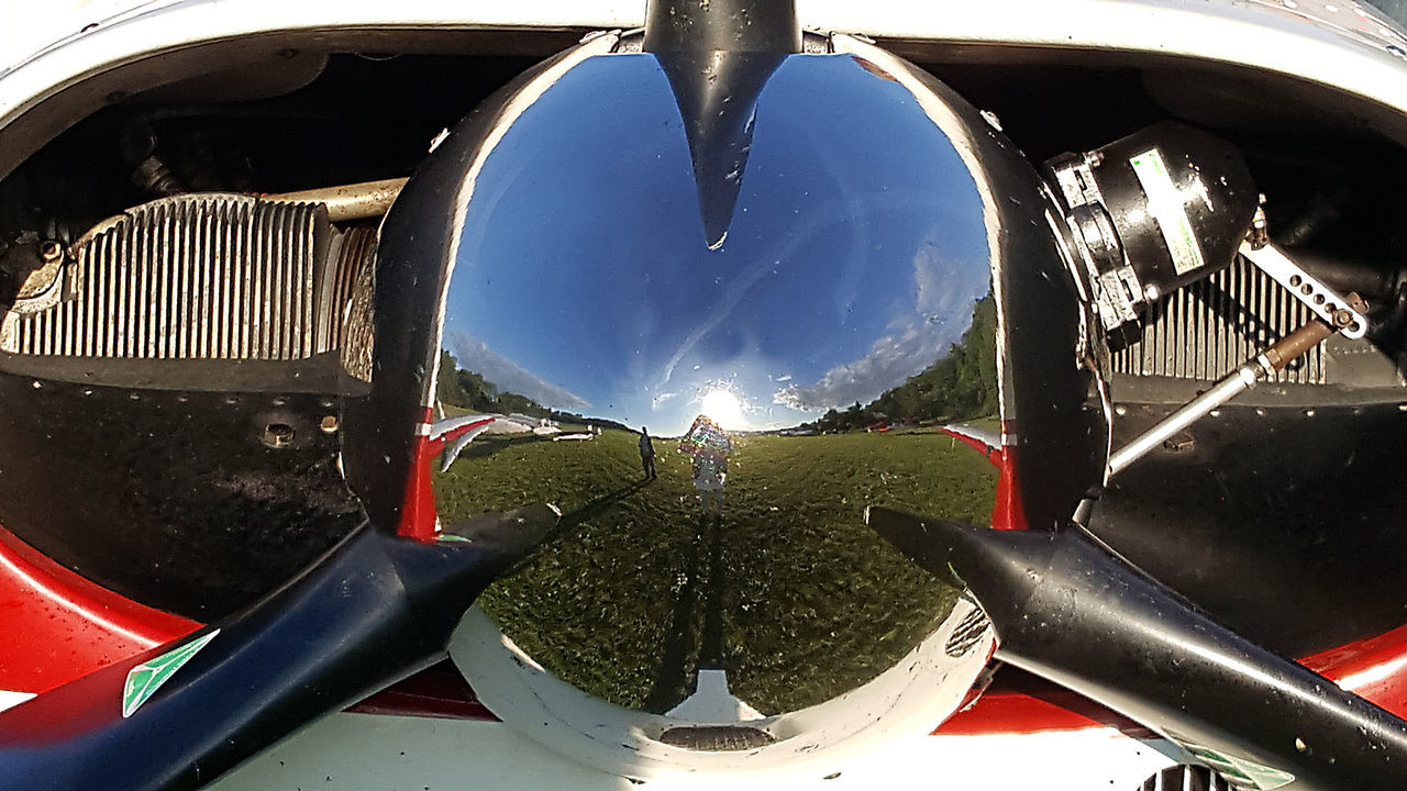 CLOSE-UP OF AIRPLANE AT AIRPORT