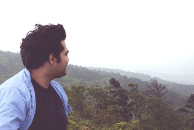 Man on landscape against sky